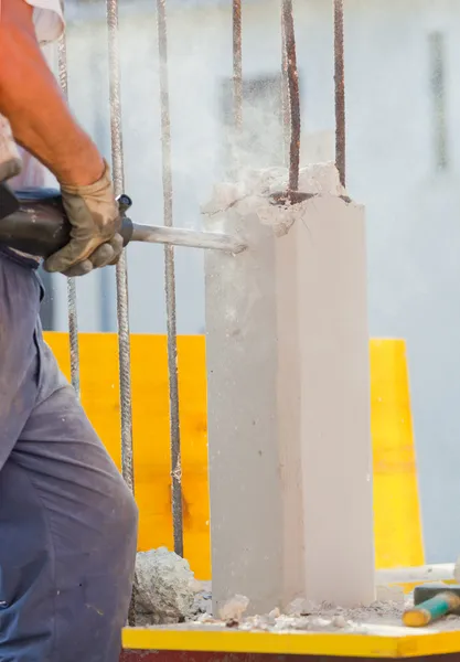 Breaking reinforced concrete with jackhammer — Stock Photo, Image