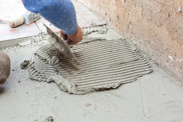 Tiler works with flooring — Stock Image Tiler works with flooring Royalty Free Stock Images