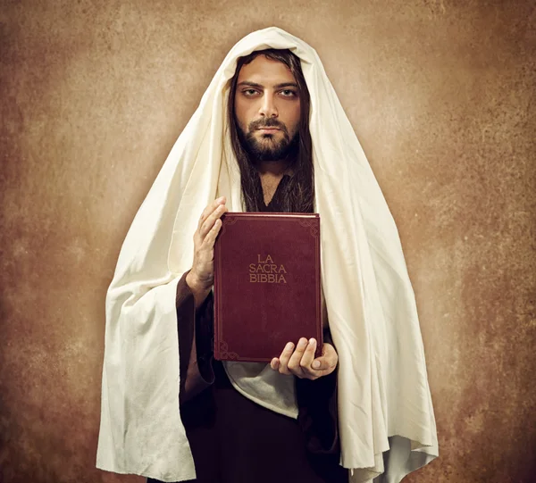 Jesus shows the holy bible — Stock Photo, Image