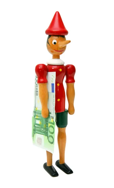 Pinocchio with 100 euro, Wooden Toy — Stock Photo, Image