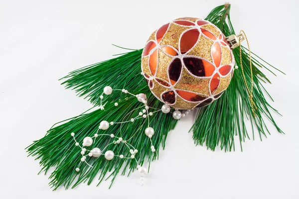 Christmas ornament on pine twig on a white background — Stock Photo, Image