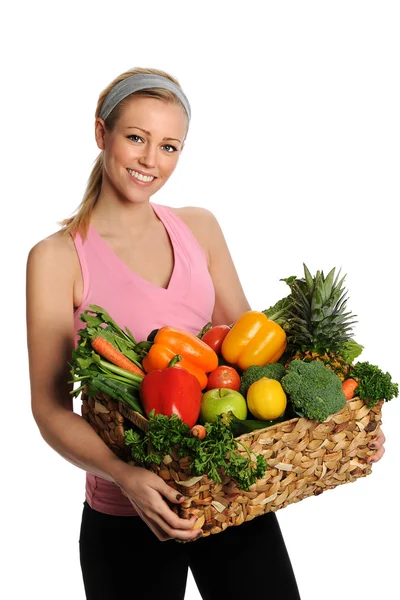 Leende ung kvinna med frukt och grönsaker — Stockfoto