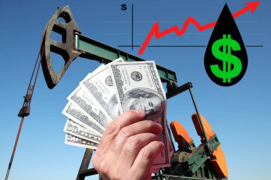 Grafik büyüme parasının önünde kırmızı ok ve bir damla ham petrolün içinde Amerikan doları sembolü olan ABD doları banknotları tutuyor. Bir kavram olarak petrol fiyatının yükseltilmesi