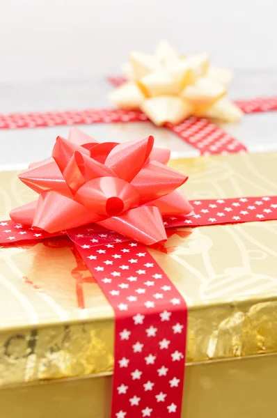 Christmas gift boxes with ribbons — Stock Photo, Image