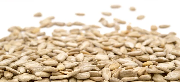 Fresh hulled sunflower seeds isolated on a white background — Stock Photo, Image