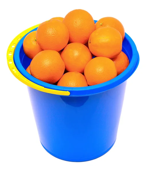 Fresh tangerines in a blue bucket — Stock Photo, Image