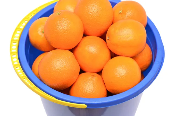 Fresh tangerines in a blue bucket — Stock Photo, Image