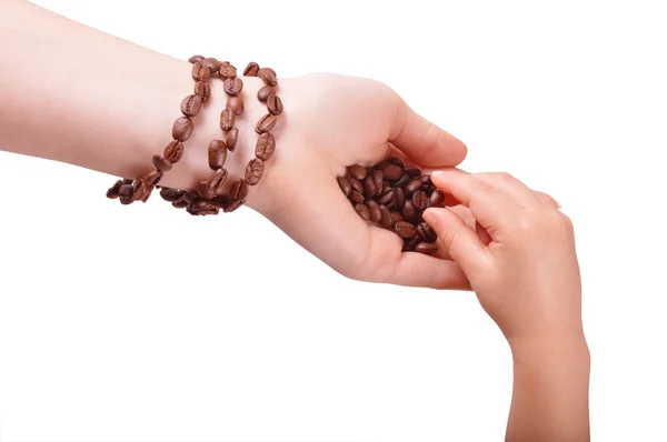Bracelet from coffee beans on a female hand — Stock Photo, Image
