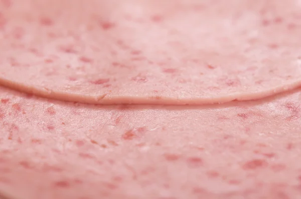 Fette di salsiccia come sfondo — Foto Stock