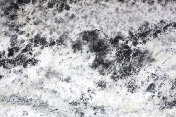 Oppervlak van natuurlijke grijze gevlekte steen als achtergrond — Stockfoto