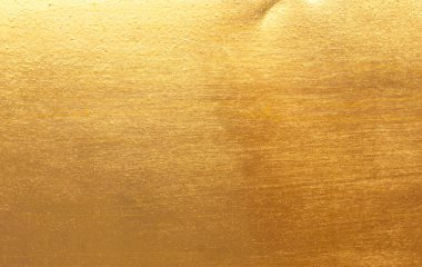 Parlak sarı yaprak altın folyo dokusu arka plan