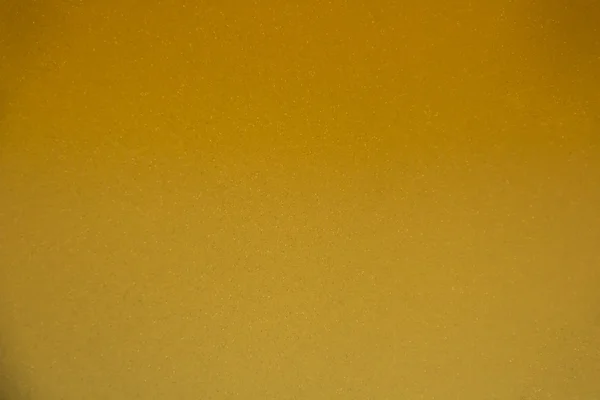 Ett stort ark av glänsande guld-omkullkastar textur bakgrund — Stockfoto