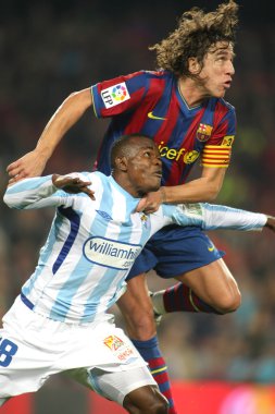 Malaga ve Barcelona Puyol(R) Obinna(L)