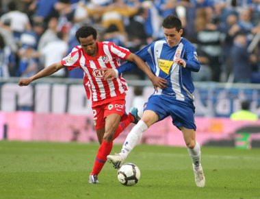 Assunçao(L) of Atletico Madrid fight with Callejon(R) Espanyol