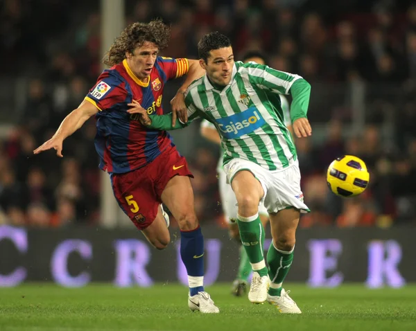 Puyol of Barcelona fight with Molina of Betis — Stock Photo, Image