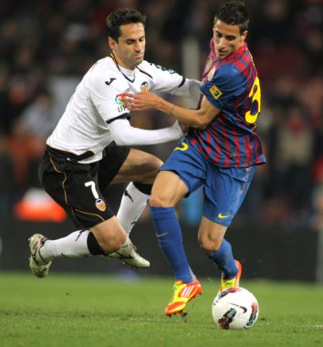Jonas Gonçalves of Valencia CF vies with Cristian Tello of FC Barcelona