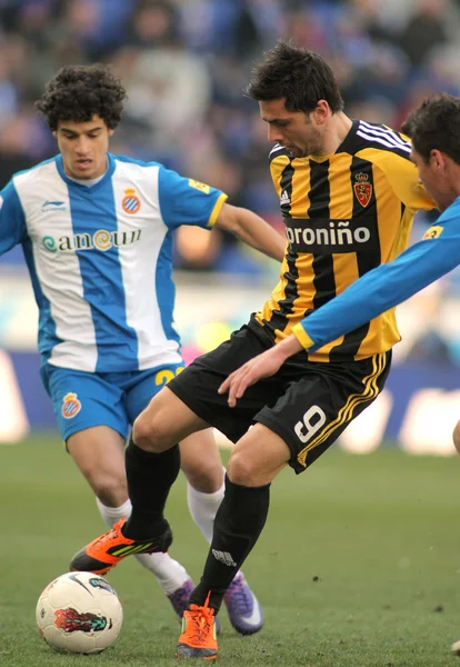 Helder Postiga(R) of Real Zaragoza vies with Coutinho(L) of RCD Espanyol — Stock Photo, Image