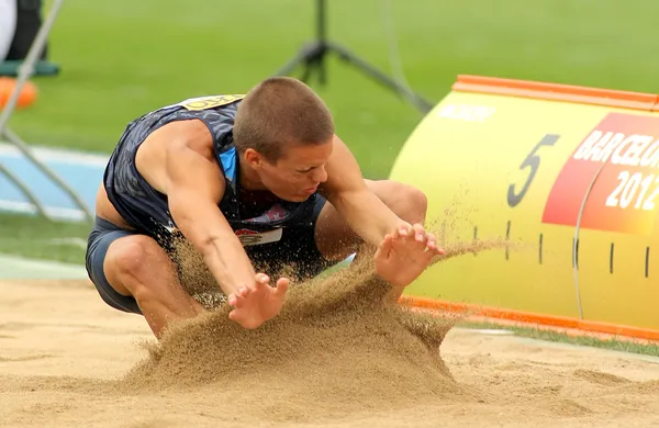 Gunnar Nixon af USA under Long Jump Decathlon begivenhed - Stock-foto