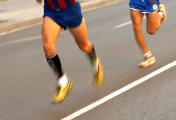 Maratona corredores pernas — Fotografia de Stock
