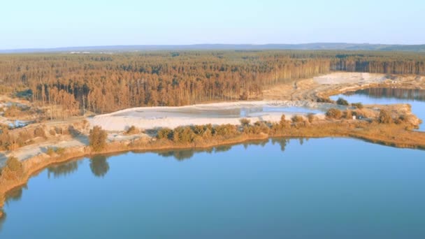 Mining of mineral natural sand near the pine forest. Aerial drone view shot. — Stok video