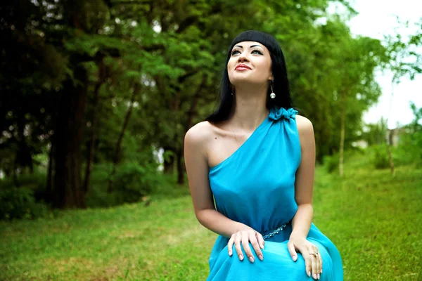 Happy lady in dress in summer garden — Stock Photo, Image