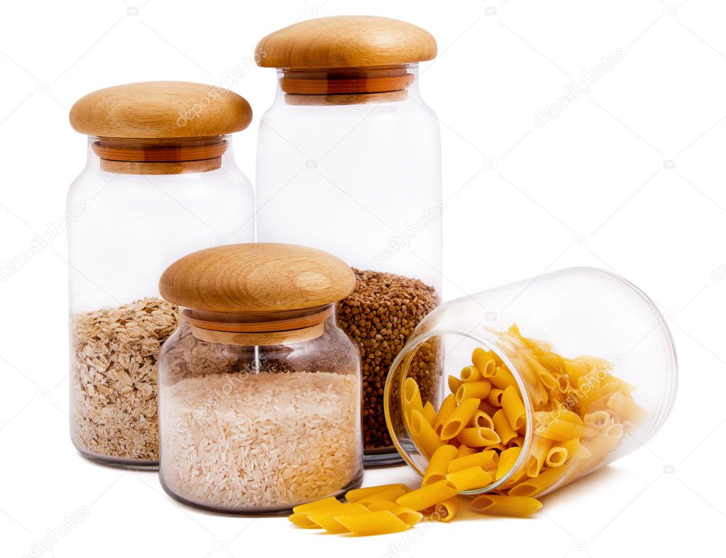 Jars with macaroni, rice, buckwheat and oatmeal isolated on whit