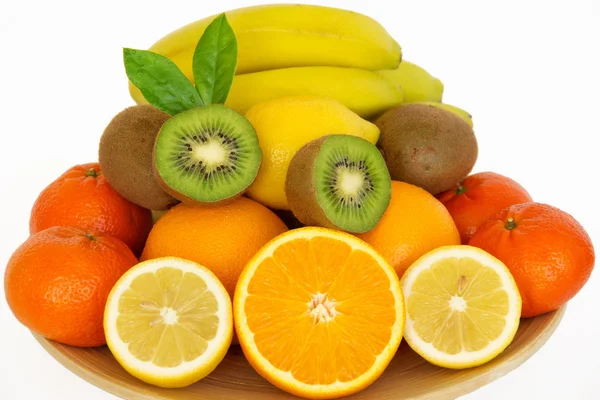 Frutta fresca succosa su un piatto . Immagine Stock