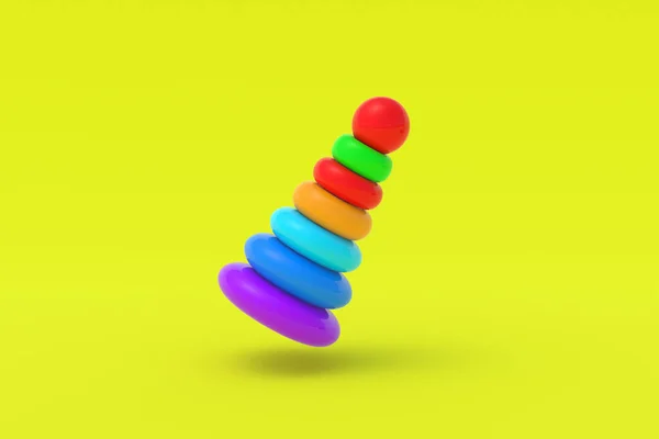 黄色の背景におもちゃのピラミッドタワー 子供教育 教育ゲーム 就学前の発達 3Dレンダリング — ストック写真