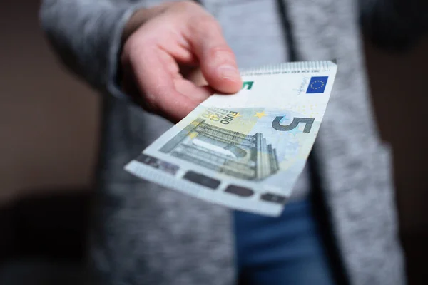 Woman counts money. female hands hold cash banknotes denominations of 5 euro currency. business man rich female hands hold and count cash banknotes euros or paper banknotes