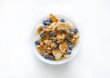 An oat cereal with blueberries, nuts and banana. Good for any project.