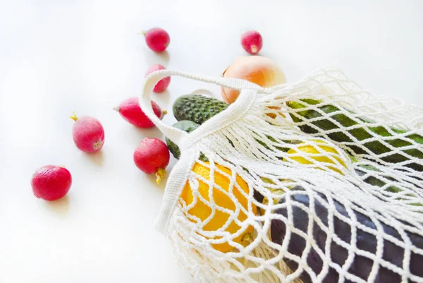 Healthy lifestyle and zero waste concept. Tote bag with vegetables with the selective focus.
