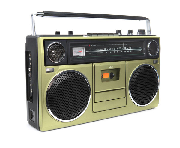 A stylish gold boombox radio from the 1970's isolated on white.