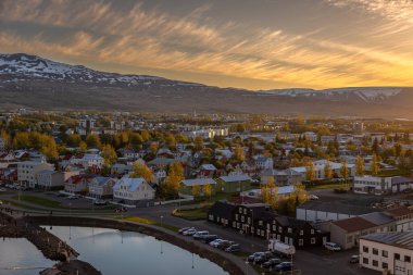 Beautiful view of Akureyri Old Town at Sunset from a high point in a summer day.