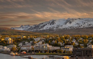 Beautiful view of Akureyri Old Town at Sunset from a high point in a summer day.