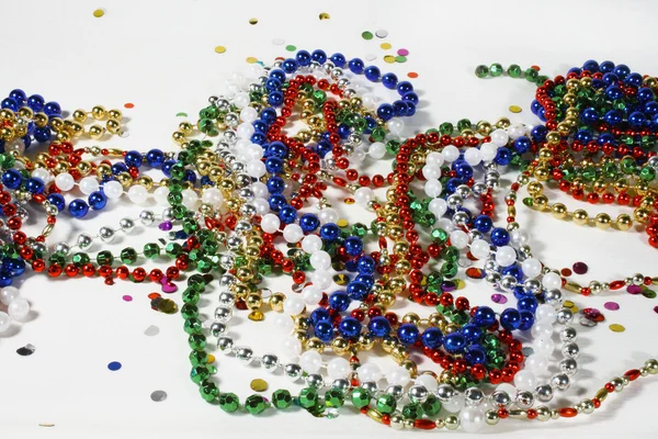 Christmas beads and Confetti — Stock Photo, Image