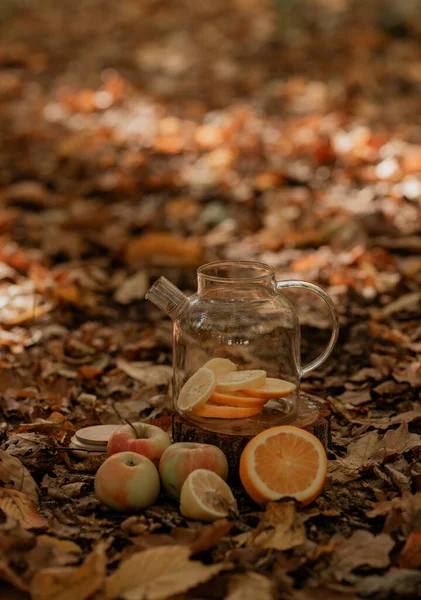 tea with orange and lemon in the forest