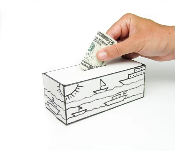 Safe with sea and five dollars being deposited — Stock Photo, Image