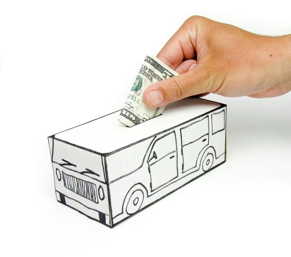 Safe with car and $ 5 deposited by hand — Stock Photo, Image