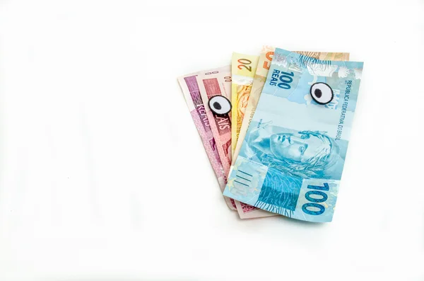 Zauważa brazylijski pieniądze patrząc w lewo — Zdjęcie stockowe