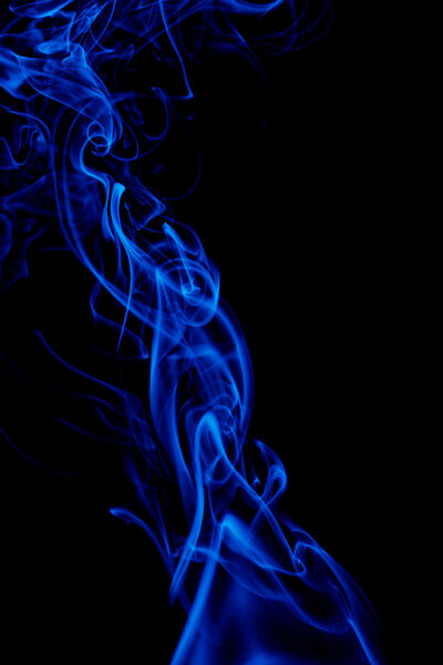 Blue smoke in black background