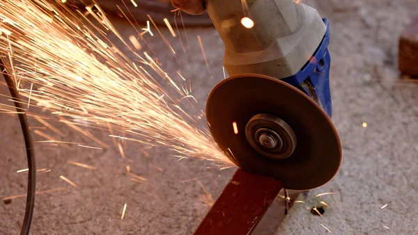 Hand grinder saw the steel — Stock Photo, Image