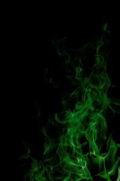Green fire on black background Royalty Free Stock Photos