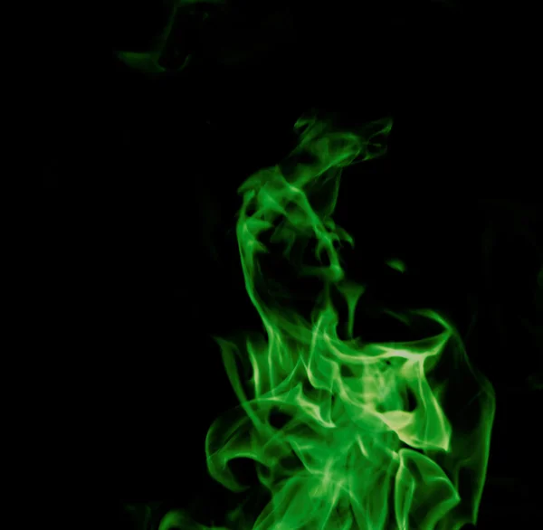 Green fire on black background — Stock Photo, Image