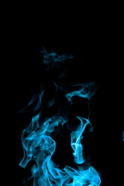 Fuoco blu su sfondo nero Immagine Stock