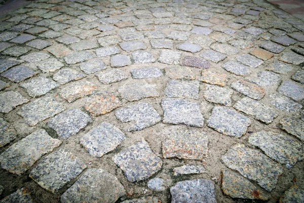 Тротуарні камені на старій дорозі — стокове фото