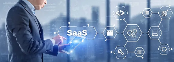 SaaS Software as a Service concept with man hand pressing text — Stock Photo, Image
