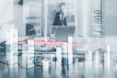 İş mumu çizelgesi. Genç işadamı ofiste..