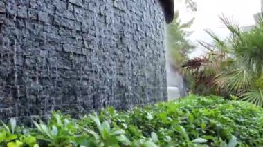 Wonderful waterfall in the beautiful nature. Water falls in public place