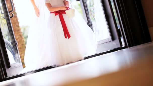 Flower Girl Scattering Petals Before Bride — Stock Video