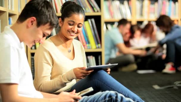 Indian classmates networking on tablets computers — Stock Video